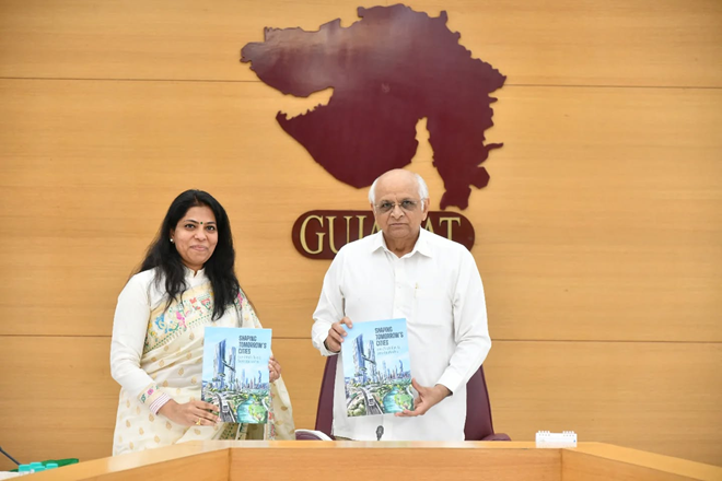 Gujarat CM releases book authored by MD, GUVNL